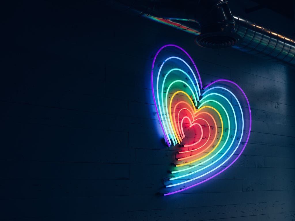 Rainbow heart shaped neon light to represent the support for HIV/AID affected people. 